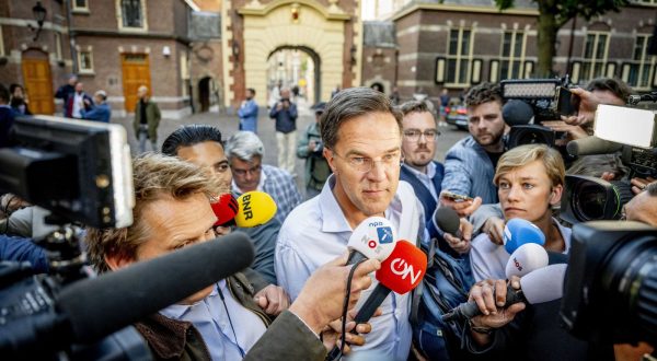epa10730898 Netherland's Prime Minister Mark Rutte (C) speaks to journalists as he arrives at the General Affairs Ministry to continue consultations on the asylum policy, in The Hague, Netherlands, 06 July 2023. Netherland's government is under great pressure amid difficult negotiations on a migration package, in which the curtailment of the influx of asylum seekers in particular is leading to major tensions between the four coalition parties.