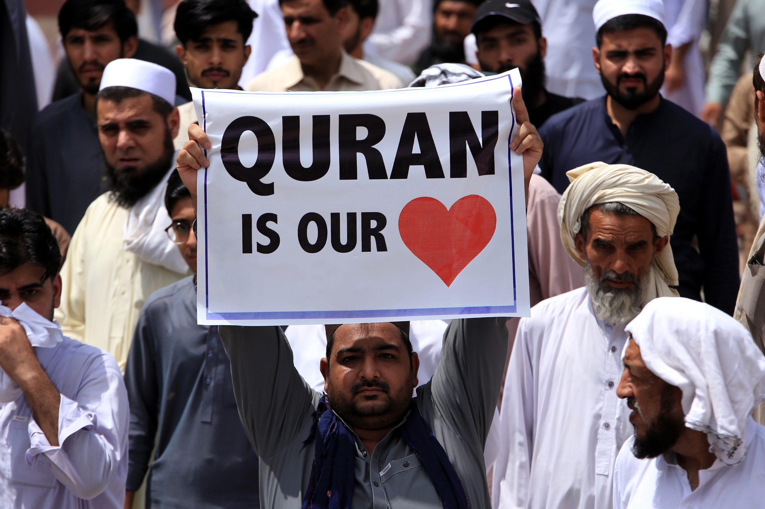 epa10732362 A man holds a placard during a protest against the burning in Sweden of a copy of the Koran, the Muslims' holy book, in Peshawar, Pakistan, 07 July 2023. Pakistan's prime minister called for nationwide protests on 07 July against a recent desecration of the Koran, the holy book of Islam, in Sweden. An Iraqi refugee living in Sweden set fire to a copy of the Koran during a protest in front of a mosque in Stockholm on 28 June 2023. The act drew widespread outrage and condemnation from several countries, including Pakistan, Turkey, Saudi Arabia, Jordan, Palestine, Morocco, Iran, Iraq, and the European Union.  EPA/BILAWAL ARBAB