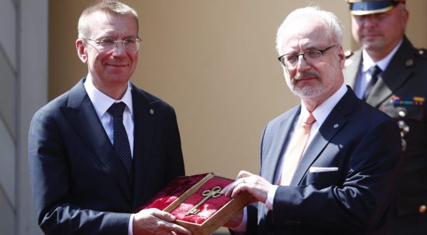 epa10733822 New Latvian President Edgars Rinkevics (L) and outgoing President Egils Levis attend the symbolic handover ceremony of the keys to Riga Castle, Latvia, 08 July 2023. Edgars Rinkevics, who was elected as the president, became the seventh president since the restoration of Latvia's independence.  EPA/TOMS KALNINS
