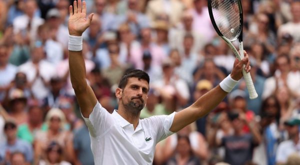 epa10737918 Novak Djokovic of Serbia celebrates winning his Men's Singles 4th round match against Hubert Hurcacz of Poland at the Wimbledon Championships, Wimbledon, Britain, 10 July 2023.  EPA/NEIL HALL   EDITORIAL USE ONLY