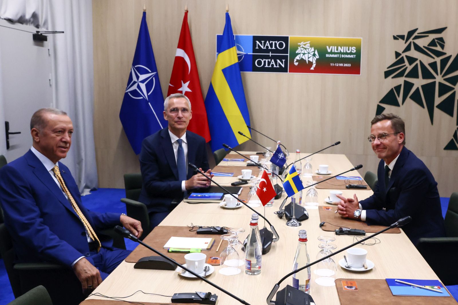 epa10738030 NATO Secretary-General Jens Stoltenberg (C), Turkish President Tayyip Erdogan (L) and Swedish Prime Minister Ulf Kristersson (R) attend a meeting, on the eve of a NATO summit, in Vilnius, Lithuania, 10 July 2023. The NATO Summit will take place in Vilnius on 11 and 12 July 2023 with the alliance's leaders expected to adopt new defense plans.  EPA/YVES HERMAN / POOL
