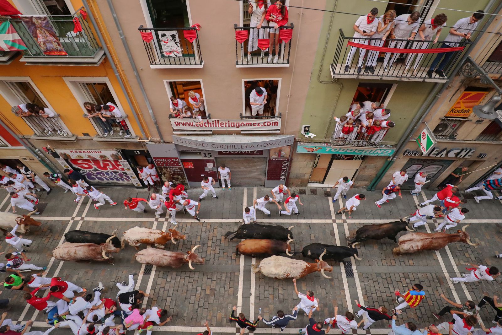 epa10740778 Runners are chased by the bulls of Jandilla ranch during the sixth bull running of Sanfermines in Pamplona, northern Spain, 12 July 2023.  EPA/J.P. Urdiroz