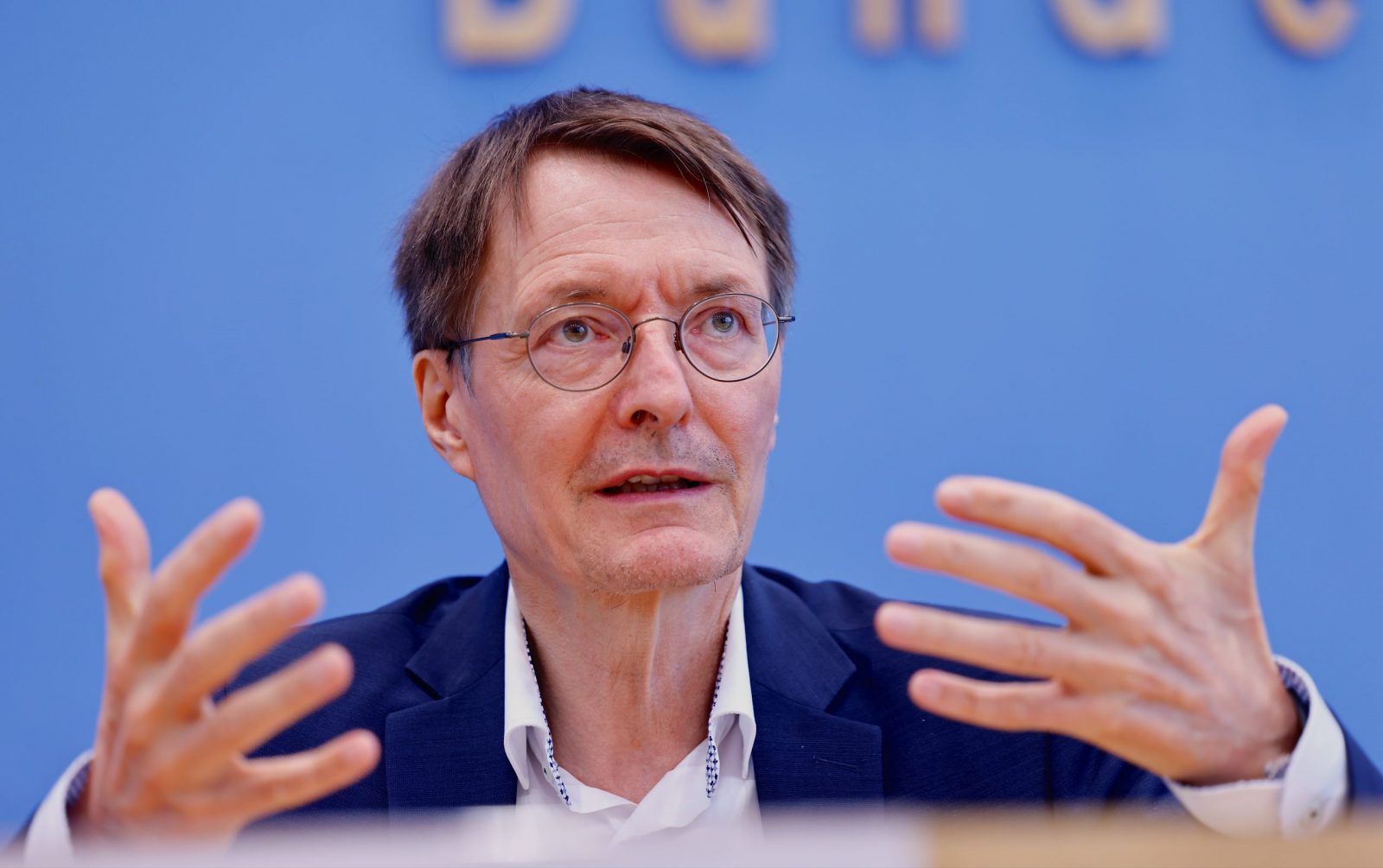 epa10741217 German Health Minister Karl Lauterbach attend a news conference to present his programme against Long Covid, in Berlin, Germany, 12 July 2023. Among other things, the SPD politician had already held out the prospect of putting the existing knowledge on Long Covid on an internet site where doctors and those affected can inform themselves with reliable data.  EPA/HANNIBAL HANSCHKE