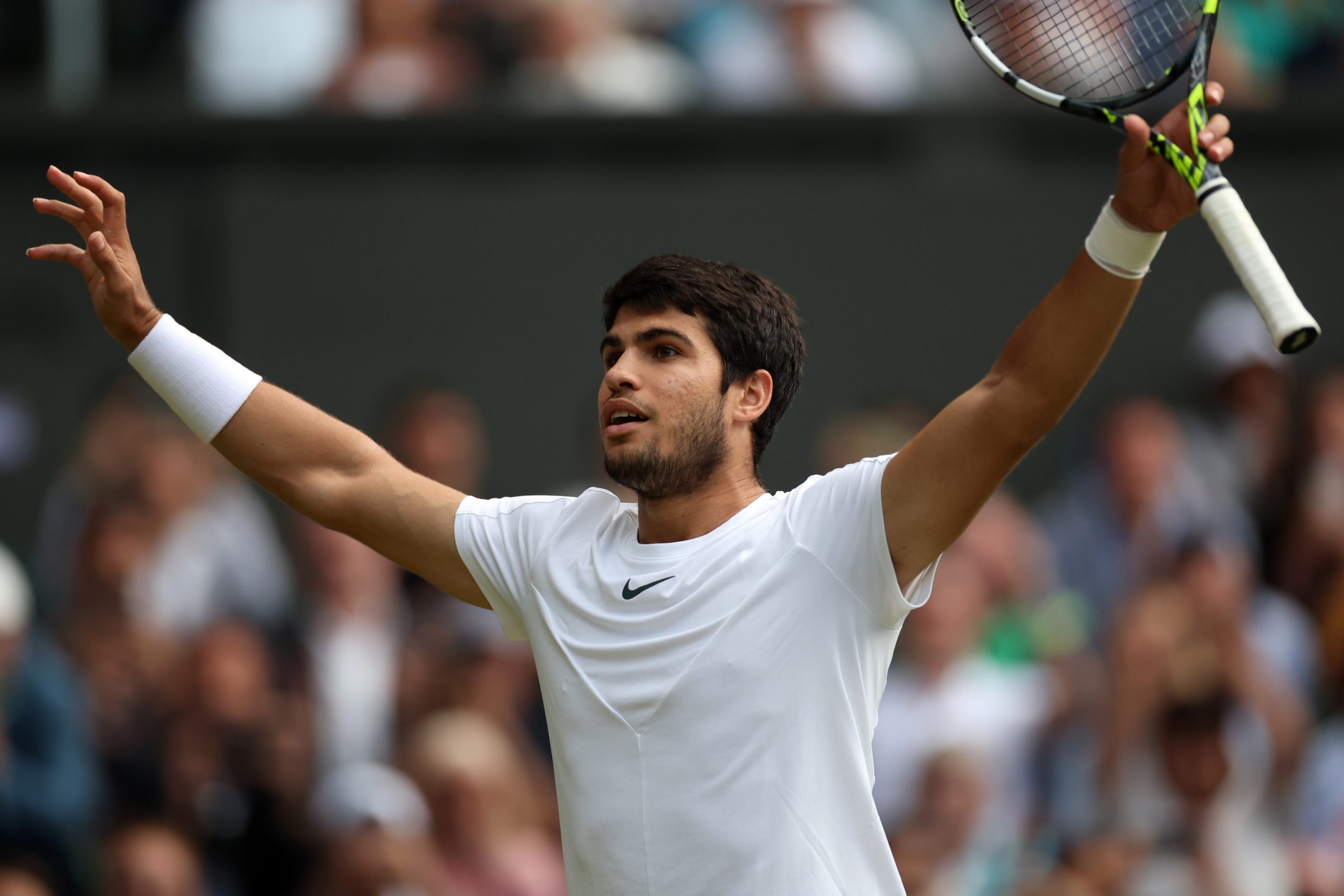 epa10742257 Carlos Alcaraz of Spain reacts after winning his Men's Singles quarter-finals match against Holger Rune of Denmark at the Wimbledon Championships, Wimbledon, Britain, 12 July 2023.  EPA/ISABEL INFANTES   EDITORIAL USE ONLY