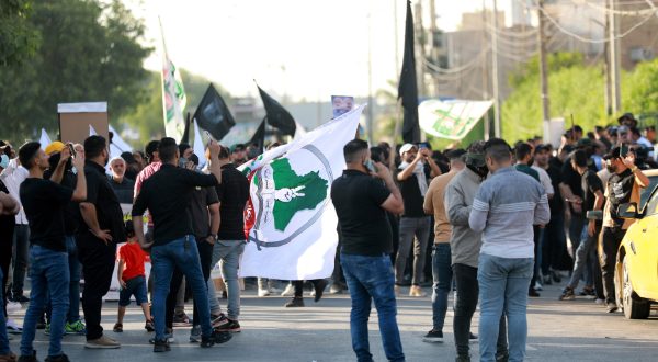 epa10746469 Supporters of Iran-backed Iraqi Shiite armed groups gather during a demonstration near the gate of the Green zone in central Baghdad, Iraq, 14 July 2023. Dozens of Supporters of Iraqi Shiite armed groups demonstrated in central Baghdad to denounce the USA influence in Iraq, while the Iraqi security forces imposed tight security measures around the government area.  EPA/AHMED JALIL
