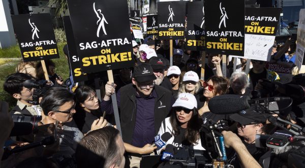 epa10746651 SAG-AFTRA (Screen Actors Guild - American Federation of Television and Radio Artists) President Fran Drescher (C-R) and National Executive Director and Chief Negotiator of SAG-AFTRA Duncan Crabtree-Ireland (C-L) attend a picket line in front of the Netflix headquarter where members of the guild and members of the WGA (Writers Guild of America) demonstrate in Los Angeles, California, USA, 14 July 2023. The decision to go on strike comes after the negotiations between SAG-AFTRA and AMPTP failed as they reached their 12 July deadline at midnight.  EPA/ETIENNE LAURENT
