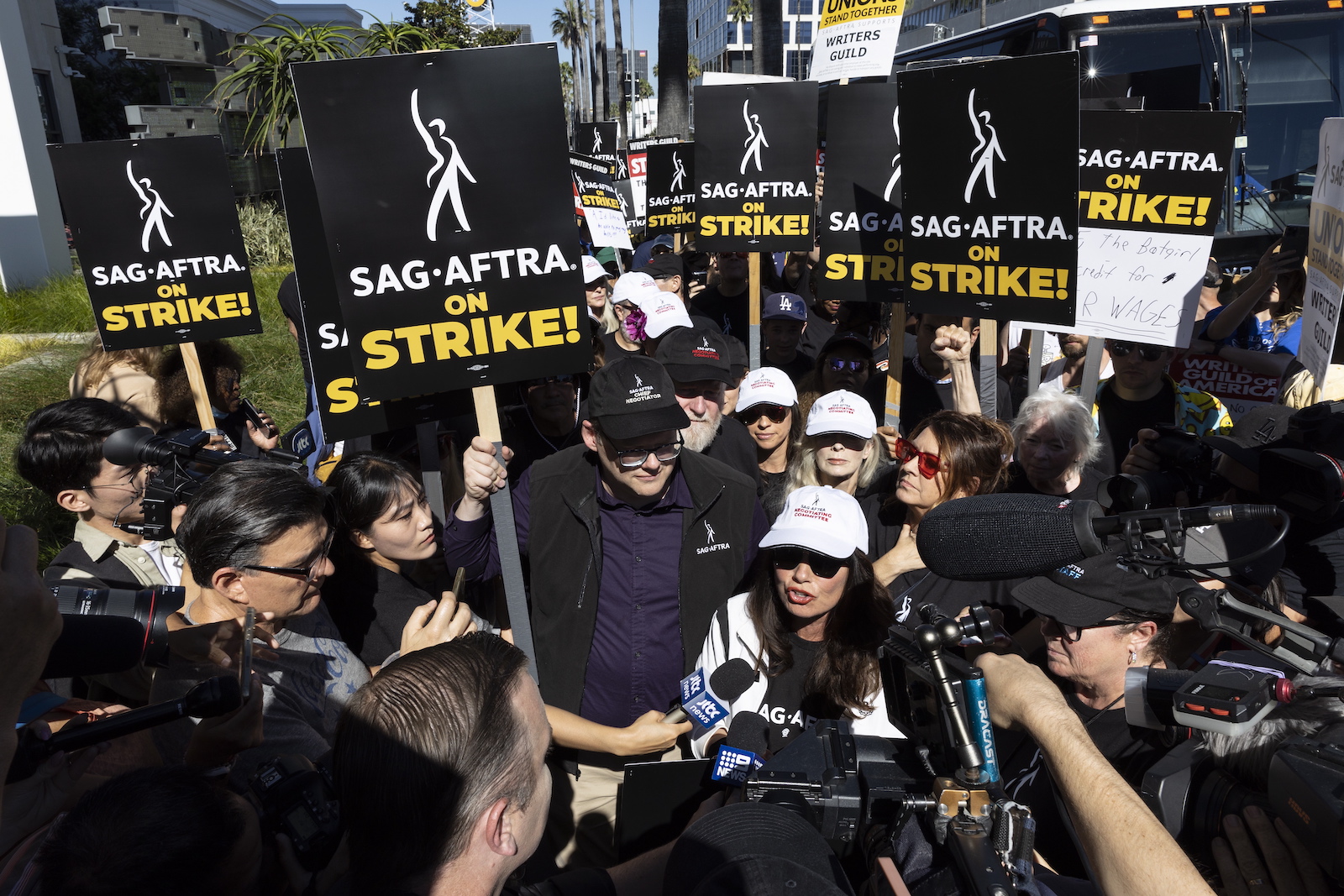 epa10746651 SAG-AFTRA (Screen Actors Guild - American Federation of Television and Radio Artists) President Fran Drescher (C-R) and National Executive Director and Chief Negotiator of SAG-AFTRA Duncan Crabtree-Ireland (C-L) attend a picket line in front of the Netflix headquarter where members of the guild and members of the WGA (Writers Guild of America) demonstrate in Los Angeles, California, USA, 14 July 2023. The decision to go on strike comes after the negotiations between SAG-AFTRA and AMPTP failed as they reached their 12 July deadline at midnight.  EPA/ETIENNE LAURENT