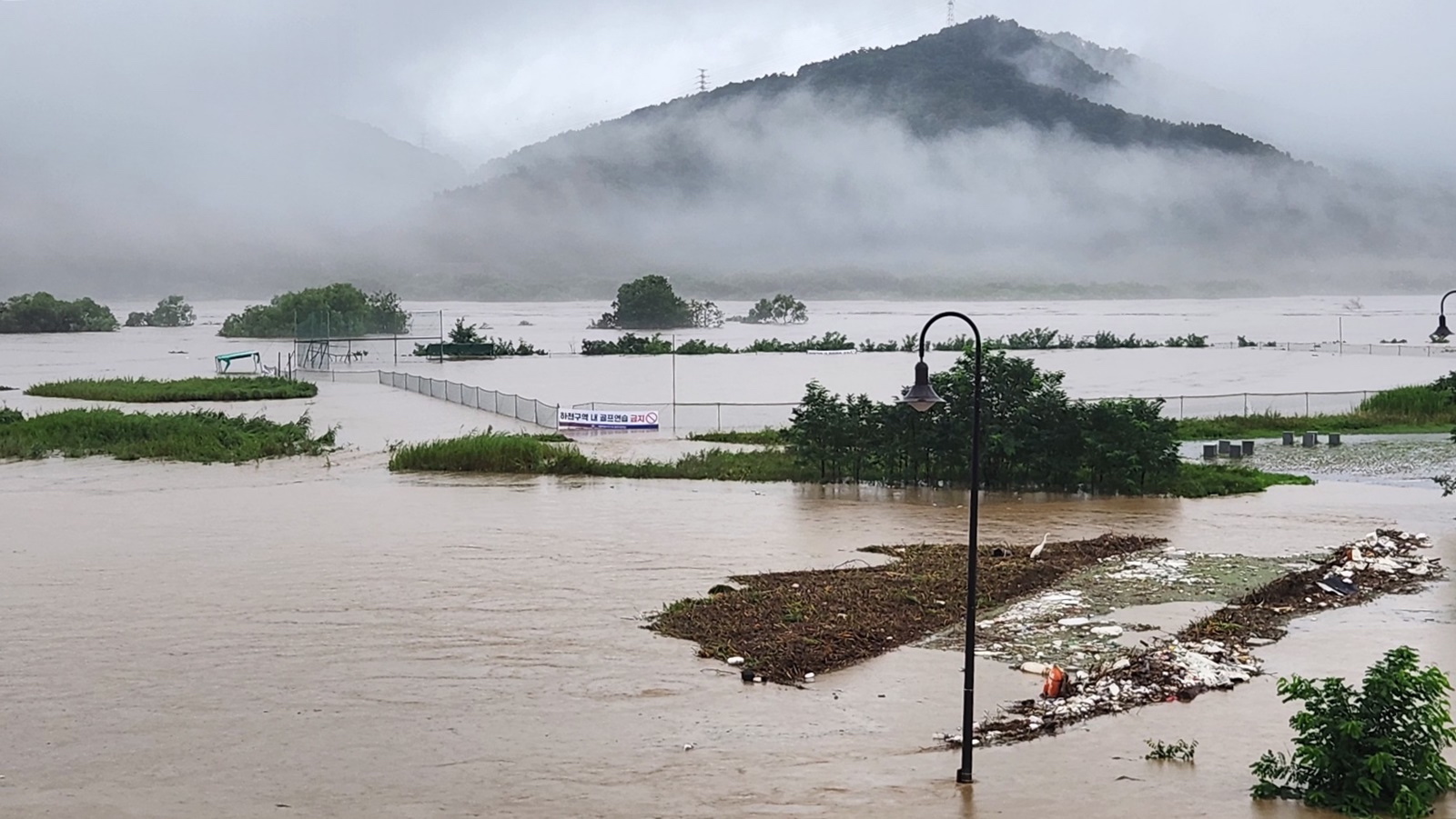 epa10747022 A baseball park is submerged by torrential rain in the central city of Sejong, South Korea 15 July 2023.  EPA/YONHAP SOUTH KOREA OUT