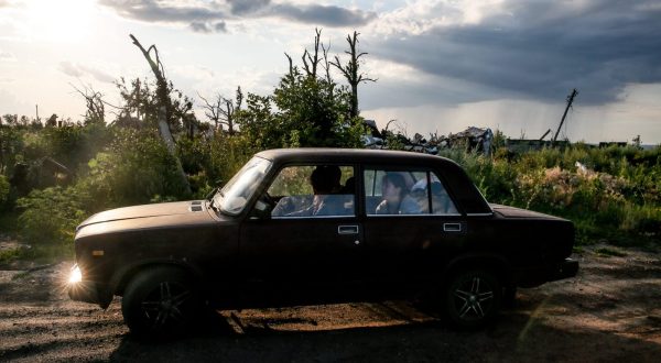 epa10748532 Mykola (41) and his family drive in Dovhenke village, Kharkiv region, Ukraine, 15 July 2023. Mykola came to his sister's destroyed family home to collect the rest of an apiary damaged during active combat in Russia's ongoing invasion of Ukraine. His own home in nearby Krasnopillia village was also destroyed during the fighting, and he was forced to move with his family to Khrestyshe, where he keeps bees and hopes to one day return home. Russian troops entered Ukraine on 24 February 2022, starting a conflict that has provoked destruction and a humanitarian crisis.  EPA/OLEG PETRASYUK  ATTENTION: This Image is part of a PHOTO SET