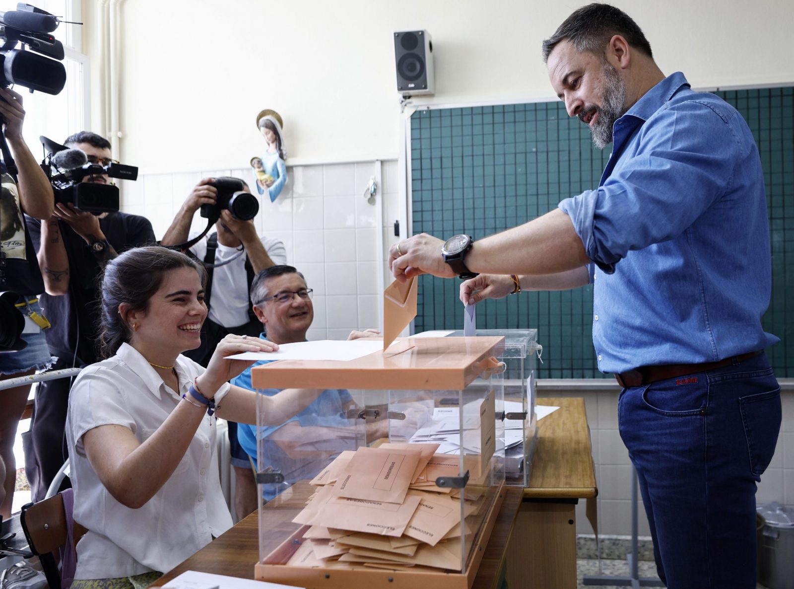 epa10763575 Spanish far-right Vox party's leader, Santiago Abascal (R), cast his ballots for the general elections at a polling station in Madrid, Spain, 23 July 2023. Spanish voters head to polling stations on 23 July to vote for the lower and the upper house of the country's parliament.  EPA/Rodrigo Jimenez