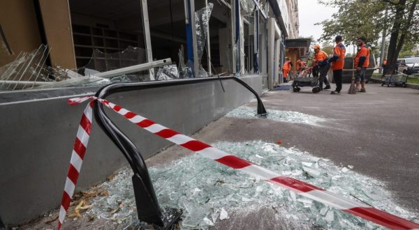 epaselect epa10765568 Municipal workers clean near a damaged building after a drone attack in Moscow, Russia, 24 July 2023. The Russian Ministry of Defense on 24 July accused Ukraine of carrying out an attack with two unmanned aerial vehicles (UAV) against facilities in Moscow, adding that the attack was foiled and the two UAVs 'were suppressed by means of electronic warfare and crashed' leaving no casualties.  EPA/YURI KOCHETKOV