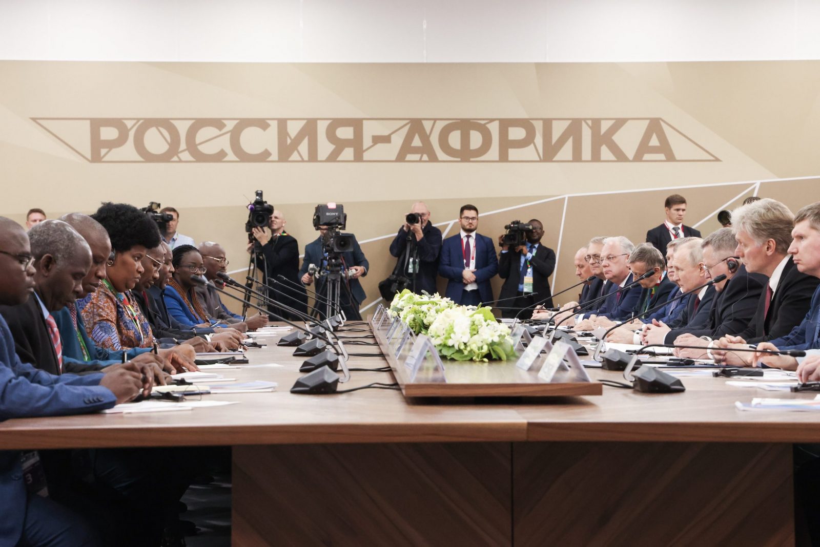 epa10771640 A handout photo made available by TASS Host Photo Agency shows Russia's President Vladimir Putin (4-R) in a meeting with participants, on the sidelines of the Second Summit Economic and Humanitarian Forum 'Russia-Africa' in St.Petersburg, Russia, 27 July 2023. The Second Summit Economic and Humanitarian Forum 'Russia-Africa' will take place from July 27 to 28 at the congress-exhibition center Expoforum in St.Petersburg.  EPA/Vyacheslav Prokofyev/ TASS Host Photo Agency/ HANDOUT  HANDOUT EDITORIAL USE ONLY/NO SALES
