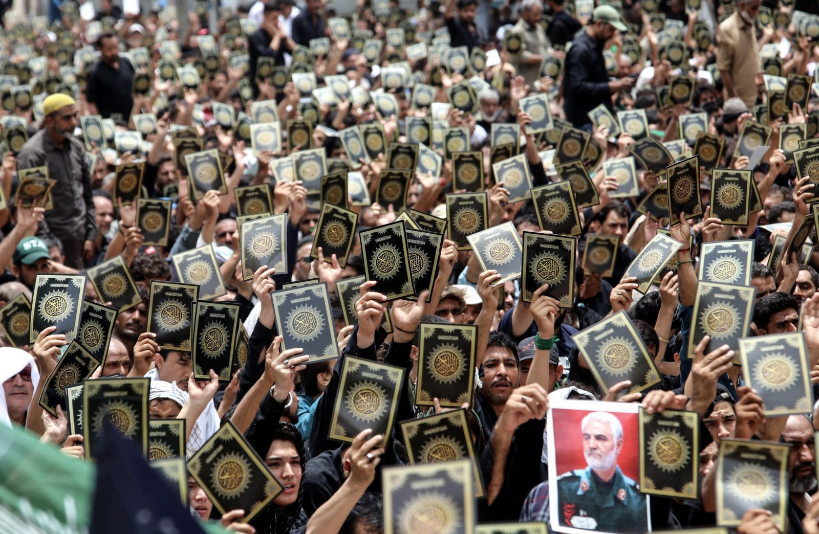 epa10775574 Pakistani Shiite Muslims hold up flyers depicting the Koran as a protest against its desecration in Sweden, on Ashura Day during the holy month of Muharram in Karachi, Pakistan, 29 July 2023. Shiite Muslims across the world are observing the holy month of Muharram, the first month of the Islamic calendar. The climax of Muharram is the Ashura Day that commemorates the martyrdom of Imam Hussein, a grandson of the Prophet Mohammed, who was killed in a battle of the Iraqi city of Karbala in the seventh century.  EPA/REHAN KHAN