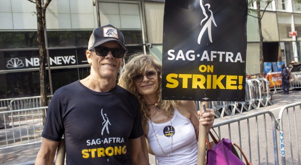 Husband and wife actors Kevin Bacon and Kyra Sedgwick are part of the picket line outside NBCUniversal at 30 Rockefeller Plaza in New York on Tuesday, July 18, 2023. Solidarity and stamina are themes on picket lines in New York as striking actors and writers are bracing for a long standoff with studios. (AP Photo/Ted Shaffrey)