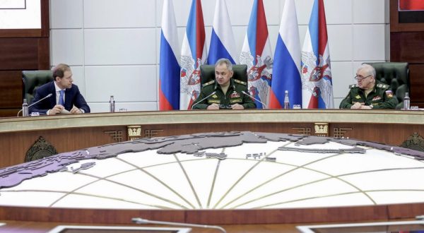 epa10725873 A handout image made available by the Russian Defence ministry press-service shows Russian Defence Minister General of the Army Sergei Shoigu (C) and Deputy Prime Minister and Minister of Trade and Industry Denis Manturov (L) attending a joint meeting of the collegium of the Russian Ministry of Defense and the Russian Ministry of Industry and Trade at the National Defense Control Center in Moscow, Russia. 04 June 2023. The meeting discussed the implementation of the state defense order, including the fulfillment by representatives of defense industry enterprises of obligations to supply weapons and military equipment to military units of the Armed Forces of the Russian Federation.  EPA/RUSSIAN DEFENCE MINISTRY PRESS SERVICE/HANDOUT HANDOUT HANDOUT EDITORIAL USE ONLY/NO SALES HANDOUT EDITORIAL USE ONLY/NO SALES