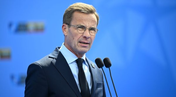 epa10738997 Sweden's Prime Minister Ulf Kristersson speaks to the media as he arrives to attend the NATO summit in Vilnius, Lithuania, 11 July 2023. The North Atlantic Treaty Organization (NATO) Summit will take place in Vilnius on 11 and 12 July 2023 with the alliance's leaders expected to adopt new defense plans.  EPA/FILIP SINGER