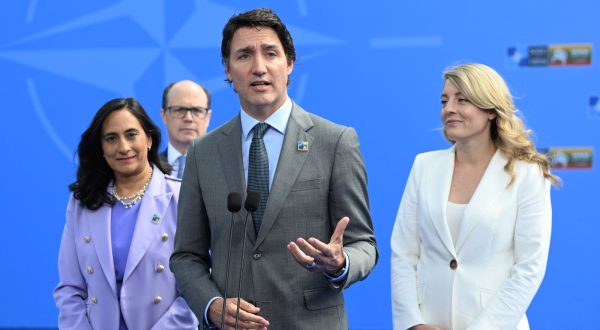 epa10738989 Canada's Prime Minister Justin Trudeau (C) speaks to the media upon his arrival to attend the NATO summit in Vilnius, Lithuania, 11 July 2023. The North Atlantic Treaty Organization (NATO) Summit will take place in Vilnius on 11 and 12 July 2023 with the alliance's leaders expected to adopt new defense plans.  EPA/FILIP SINGER