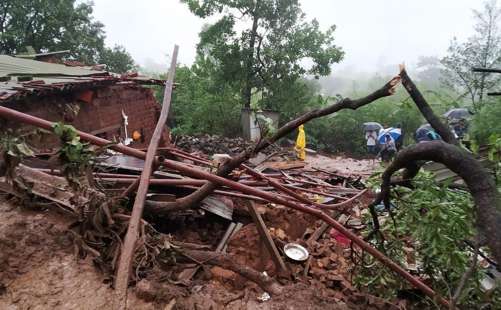 epa10758111 National Disaster Response Force (NDRF) personnel along with others perform a rescue operation after a landslide in Irshalwadi village in Raigad district, Maharashtra, India, 20 July 2023. At least 10 people were killed and several are feared to be trapped under a massive landslide in Maharashtra's Khalapur in Raigad district. Rescue operations were hampered, local police said.  EPA/DIVYAKANT SOLANKI