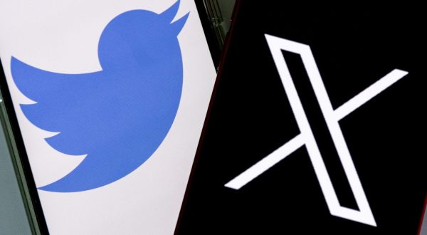 epa10772444 An illustration pictures shows two mobile phones displaying the 'Twitter' and 'X' logos, in Los Angeles, California, USA, 27 July 2023. Twitter announced on 23 July that it will rebrand to X.  EPA/ETIENNE LAURENT