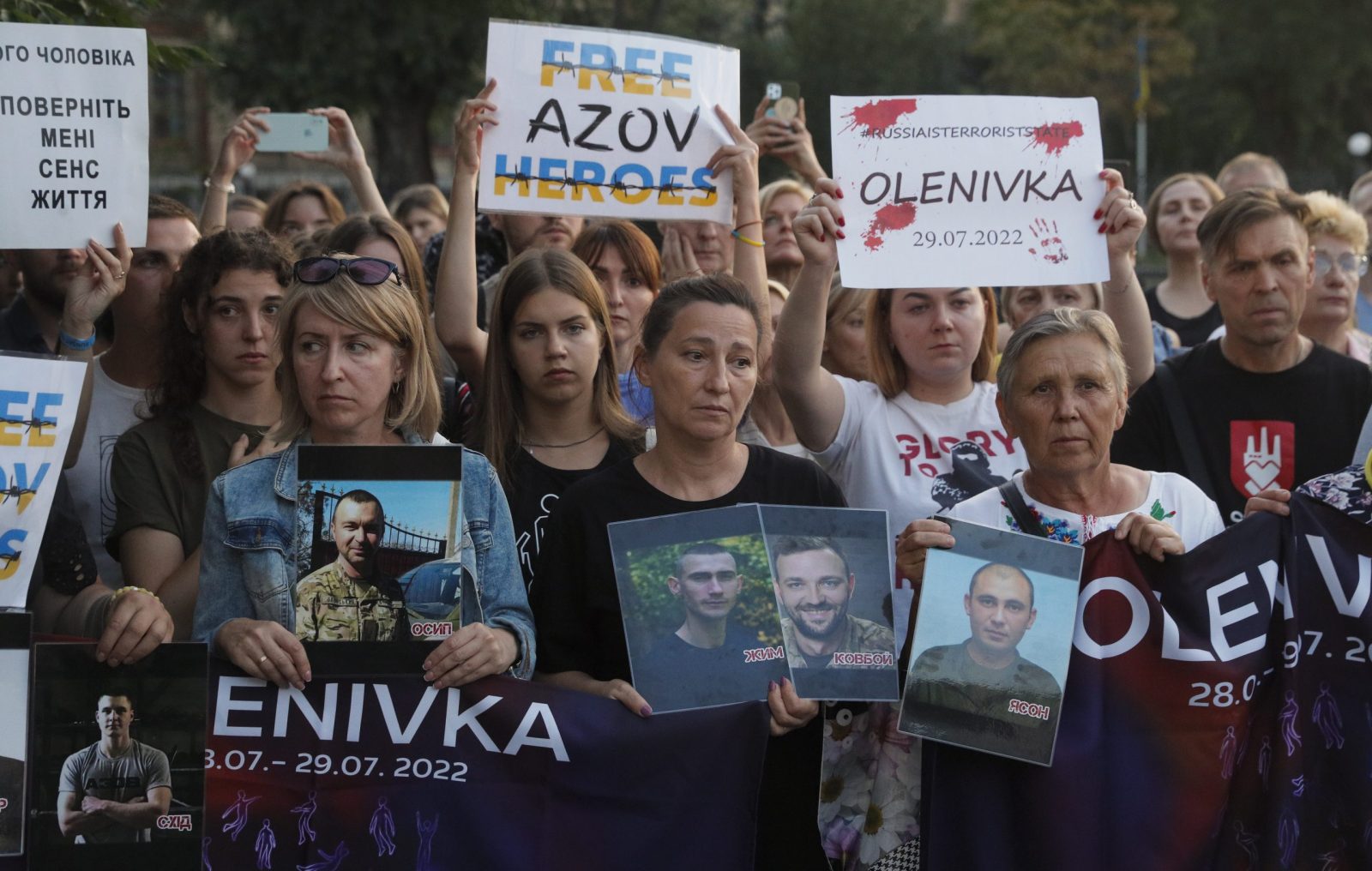 epa10776123 Relatives and friends of the defenders of the Azovstal Iron and Steel Works attend a ceremony to remember the victims of the Olenivka camp explosion one year on, as they gathered near the Russian embassy building in Kyiv, Ukraine, 29 July 2023. On 29 July 2022 a building housing Ukrainian prisoners of war in Olenivka, eastern Ukraine, was destroyed, killing more than 50 people, amid the Russian invasion of Ukraine. According to Ukraine, the majority of the prisoners were soldiers from the Azovstal complex of Mariupol. Ukraine and Russia accused each other of being behind the attack.  EPA/SERGEY DOLZHENKO