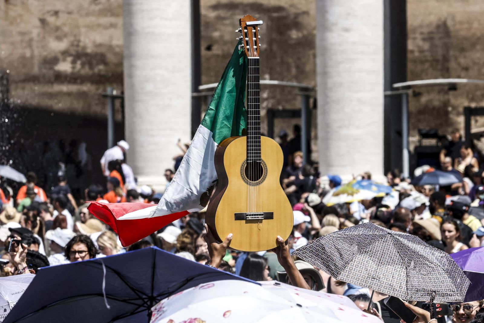 epa10776929 Faithful gather to attend the Angelus prayer held by Pope Francis (not pictured) in St. Peter's Square in Vatican City, 30 July 2023.  EPA/FABIO FRUSTACI