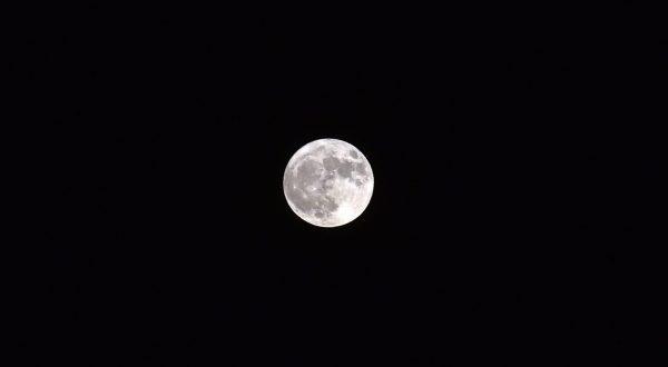 epa10780378 The Super Full Moon also called ‘The Sturgeon’ rises in the sky in Beirut, Lebanon, 01 August 2023. The super full moon is named this way because it is at its closest to earth and this appears bigger than a normal full moon. There are generally two to four super moons per year depending on the moon's closeness to earth.  EPA/WAEL HAMZEH