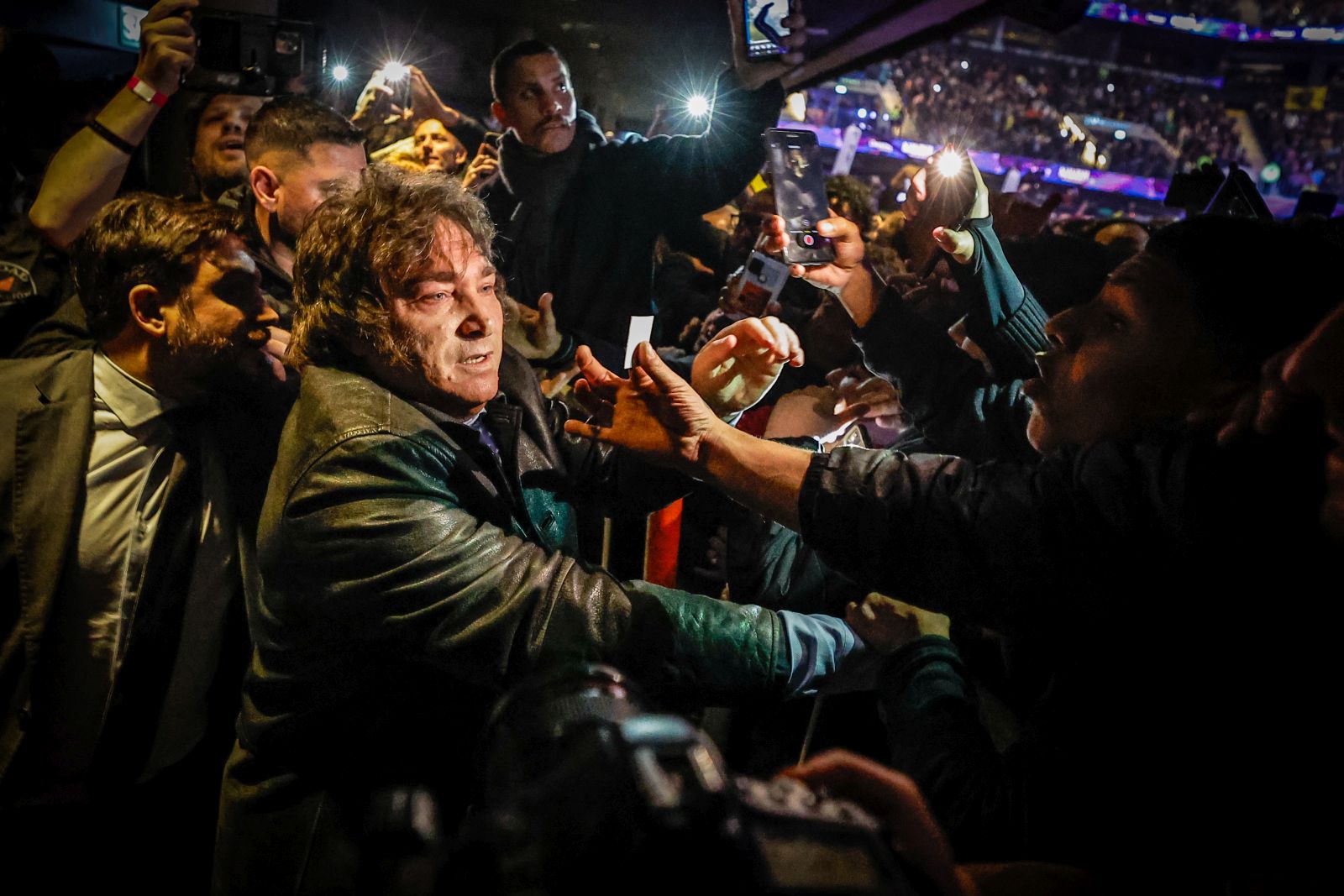 epa10789827 Presidential candidate for the Libertad Avanza party Javier Milei (L) greets his supporters during his campaign closing ceremony in Buenos Aires, Argentina, on 07 August 2023. Argentina will hold primaries on 13 August ahead of the 22 October 2023 general elections.  EPA/JUAN IGNACIO RONCORONI