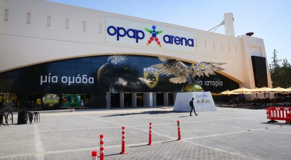 epa10790366 A man walks outside the AEK football club stadium in Nea Philadelphia where on the night of 07 August, a 29-year-old man was knifed to death during clashes between football supporters, in Athens, Greece, 08 August 2023. He was one of nine people in total who were injured during violent incidents between AEK and Dinamo Zagreb supporters. Strong police forces were sent to stop the violence, detained 98 people involved in the incidents, while an inquiry to locate additional culprits and shed light on any other aspect of the case is continuing.  EPA/ORESTIS PANAGIOTOU