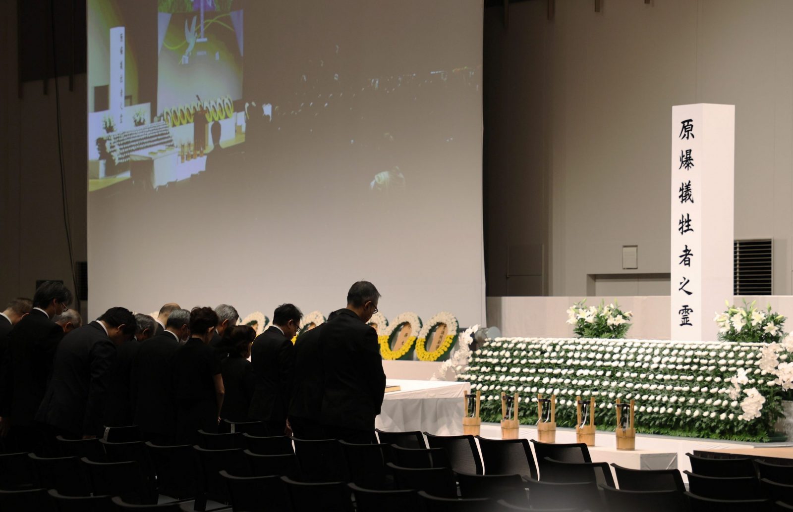 epa10791442 Attendants offer a one minute silent prayer for victims of the atomic bombing of Nagasaki at the time when the atomic bomb exploded during an indoor memorial service in Nagasaki, Nagasaki Prefecture, 09 August 2023, marking the 78th anniversary of the bombing. The cathedral canceled a night mass and Nagasaki City was forced to change the schedule of the memorial service for victims due to typhoon Khanun. Nagasaki City has announced the toll of victims from the atomic bombing rose to about 74,000. The figure was counted as the end of 1945 after the August 9 bombing.  EPA/JIJI PRESS JAPAN OUT EDITORIAL USE ONLY/