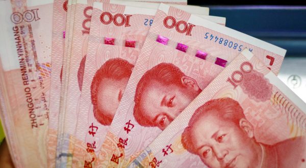 epa10791423 An illustration picture shows banknotes of 100 Chinese Yuan or Renminbi (RMB) in Beijing, China, 09 August 2023. China's consumer price index declined 0.3 percent in July compared to last year, National Bureau of Statistics said.  EPA/MARK R. CRISTINO