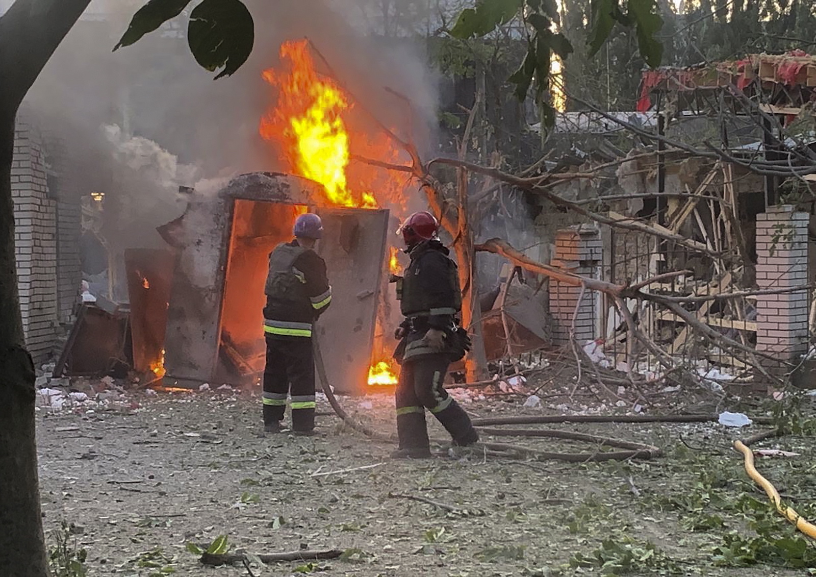 epa10792374 A handout picture made available by the State Emergency Service of Ukraine shows firefighters working in the aftermath of a rocket attack in Zaporizhzhia, Ukraine, 09 August 2023 amid the Russian invasion. At least two people died and seven others were injured when a rocket hit a church, the State Emergency Service reported.  EPA/STATE EMERGENCY SERVICE HANDOUT  HANDOUT EDITORIAL USE ONLY/NO SALES