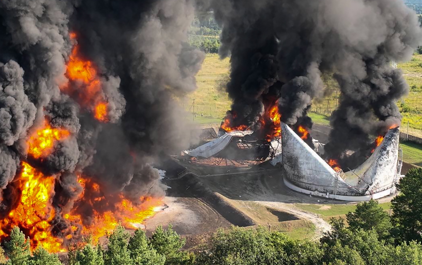 epa10793139 A handout picture made available by the Rivne Region Prosecutor's Office shows the aftermath of shelling by shock drones on an oil depot in the Rivne region, Western Ukraine, 10 August 2023, amid the Russian invasion. No injured people were reported, the Rivne Region Prosecutor's Office confirmed.  EPA/RIVNE REGION PROSECUTOR'S OFFICE HANDOUT EDITORIAL USE ONLY/NO SALES HANDOUT EDITORIAL USE ONLY/NO SALES