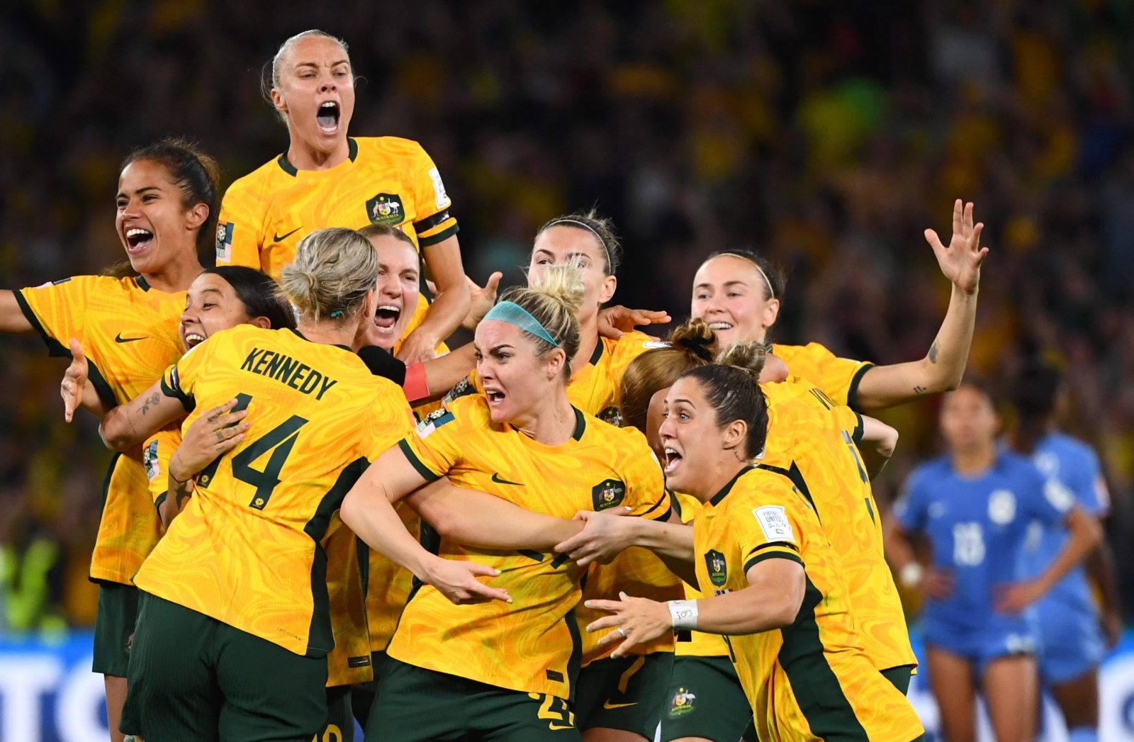 epa10796516 Players of Australia celebrate after winning the FIFA Women's World Cup 2023 Quarter Final soccer match between Australia and France at Brisbane Rectangular Stadium in Brisbane, Australia, 12 August 2023.  EPA/JONO SEARLE  AUSTRALIA AND NEW ZEALAND OUT
