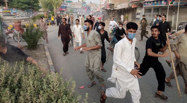 epa10803016 People gather as situation remains tense after mobs burn Christian churches and homes after blasphemy allegations in Jaranwala, near Faisalabad, Pakistan, 16 August 2023. Armed mobs in Jaranwala, targeted two churches and private homes, setting them on fire and causing widespread destruction. The attack was sparked by the discovery of torn pages of the Muslims holy book Koran with alleged blasphemous content near a Christian colony. Punjab police attempted to control the situation, and two local Christian residents were charged under blasphemy laws. The incident deeply affected the Christian community, with families fleeing the area for safety. Blasphemy is a highly sensitive issue in Pakistan, often leading to violence, drawing international condemnation and raised concerns about the misuse of blasphemy laws and the need for religious tolerance and minority protection.  EPA/ILYAS SHEIKH