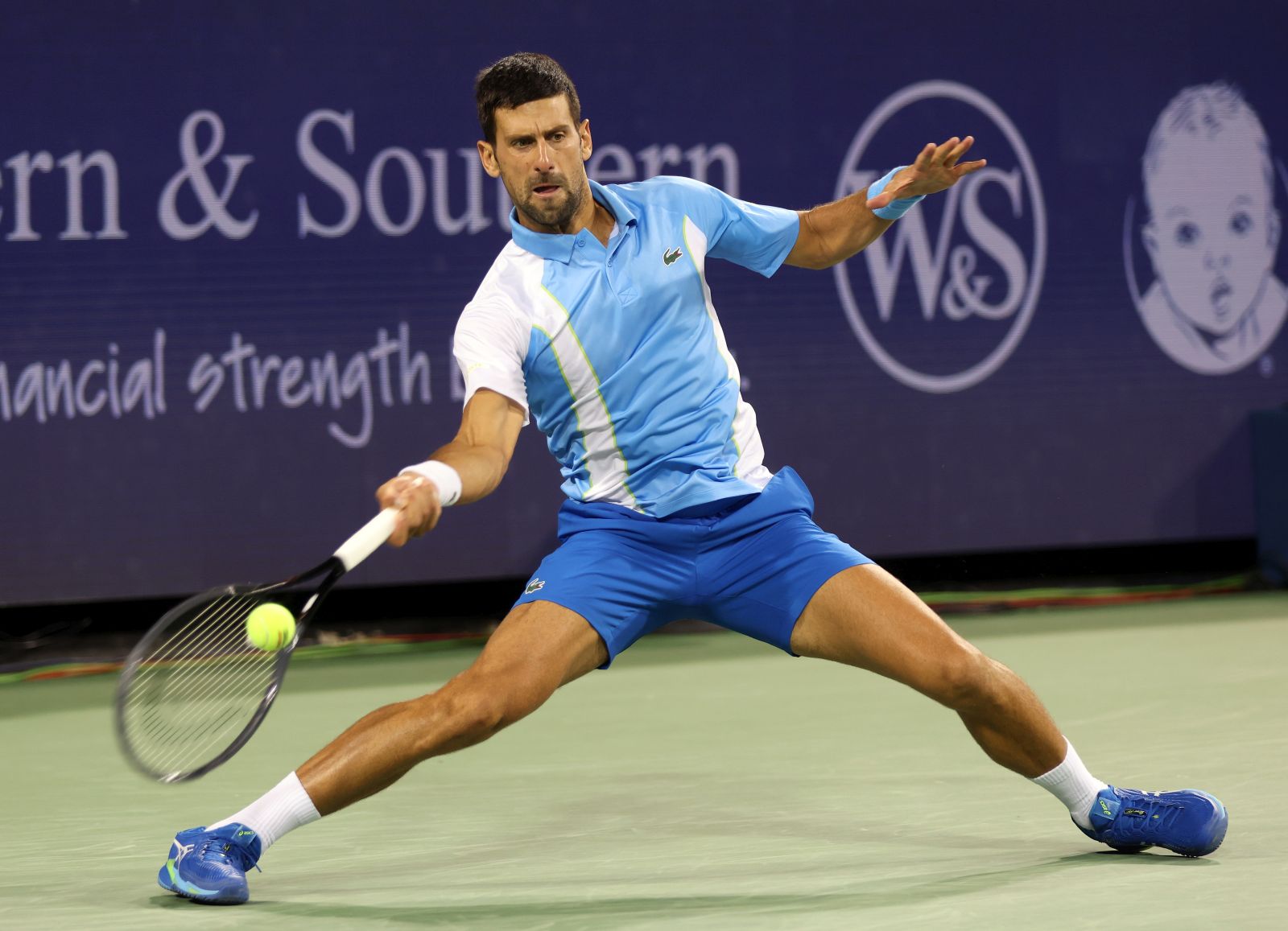 epa10808616 Novak Djokovic of Serbia returns a volley to Alexander Zverev of Germany during the semi-final round of the Western and Southern Open at the Lindner Family Tennis Center in Mason, Ohio, USA, 19 August 2023.  EPA/MARK LYONS
