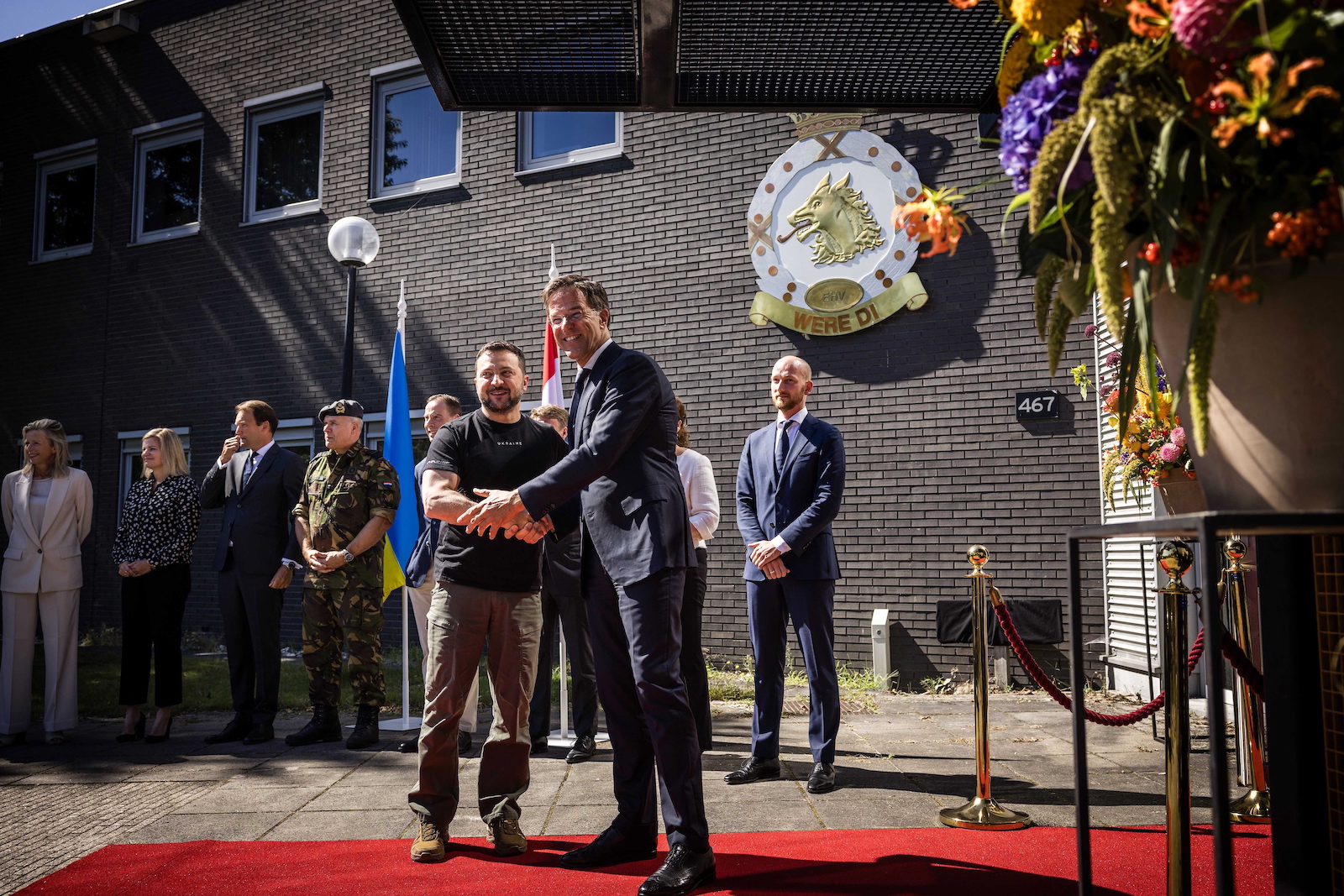 epa10809269 Ukrainian President Volodymyr Zelensky (L) is welcomed by Dutch outgoing Prime Minister Mark Rutte during Zelensky's visit at Eindhoven Air Base, in Eindhoven, the Netherlands, 20 August 2023.  EPA/ROB ENGELAAR