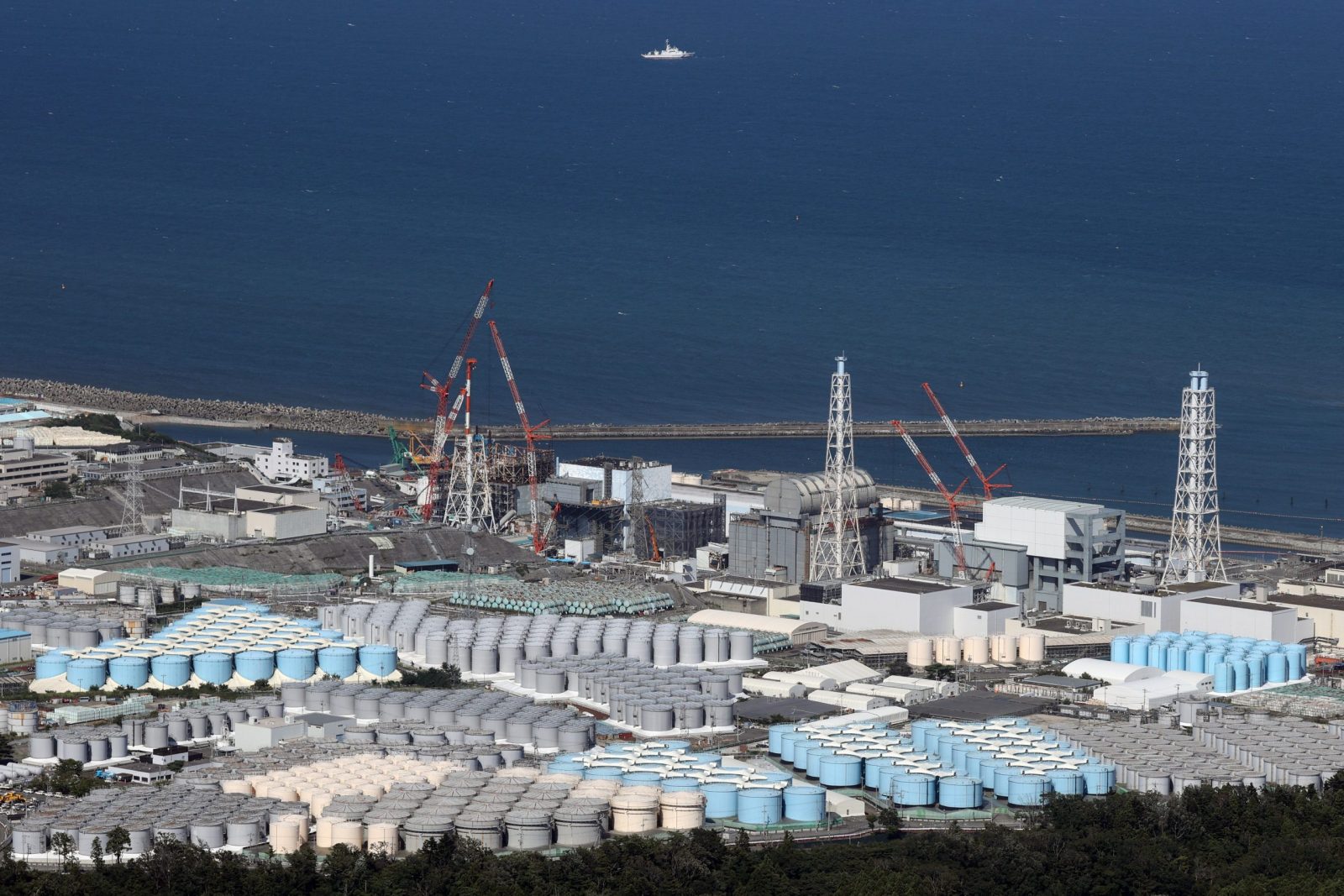 epa10817312 An aerial picture of the Fukushima Daiichi nuclear power plant and its tanks containing radioactive water in Okuma, Fukushima Prefecture, Japan, 24 August 2023. On 24 August in the early afternoon, plant operator Tokyo Electric Power Company Holdings Inc. (TEPCO) started the discharge of treated radioactive water from the Fukushima nuclear power plant into the Pacific Ocean despite opposition of local fishermen and some neighboring countries. It shall take as long as 30 years to complete the release of the treated radioactive water from more than 1,000 tanks.  EPA/JIJI PRESS JAPAN OUT EDITORIAL USE ONLY/