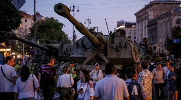 epa10818618 People explore damaged Russian armored military vehicles that were seized by the Ukrainian army amid the Russian invasion, along Khreshchatyk Street in Kyiv (Kiev), Ukraine, 24 August 2023, during Independence Day celebrations. The damaged Russian military machinery has been set up in downtown Kyiv to form part of the Independence Day celebrations.  EPA/OLEG PETRASYUK