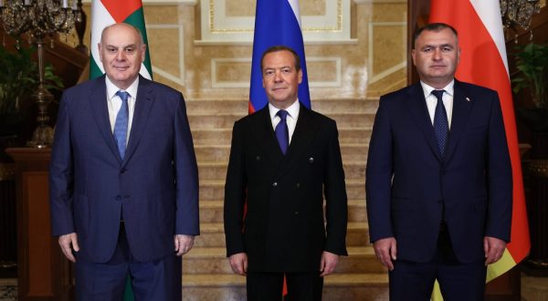 epa10819776 Deputy head of Russia's Security Council and chairman of the United Russia party, Dmitry Medvedev (C) poses for a picture during his meeting with President of the Republic of Abkhazia Aslan Bzhania (L) and President of the Republic of South Ossetia Alan Gagloev (R) in Moscow, Russia, 25 August 2023.  EPA/VALERY SHARIFULIN / SPUTNIK / GOVERNMENT PRESS SERVICE POOL
