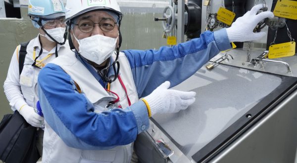 epa10823022 TEPCO official Kenichi Takahara speaks during a tour for foreign media on a facility to take samples of treated radioactive wastewater after dilution for testing before release, part of the facility for the releasing treated radioactive water to sea from the Fukushima Daiichi nuclear power plant, operated by Tokyo Electric Power Company Holdings, also known as TEPCO, in Futaba town, northeastern Japan, 27 August 2023. On 24 August in the early afternoon, plant operator Tokyo Electric Power Company Holdings Inc. (TEPCO) started the discharge of treated radioactive water from the Fukushima nuclear power plant into the Pacific Ocean despite opposition of local fishermen and some neighboring countries. It shall take as long as 30 years to complete the release of the treated radioactive water from more than 1,000 tanks.  EPA/EUGENE HOSHIKO / POOL
