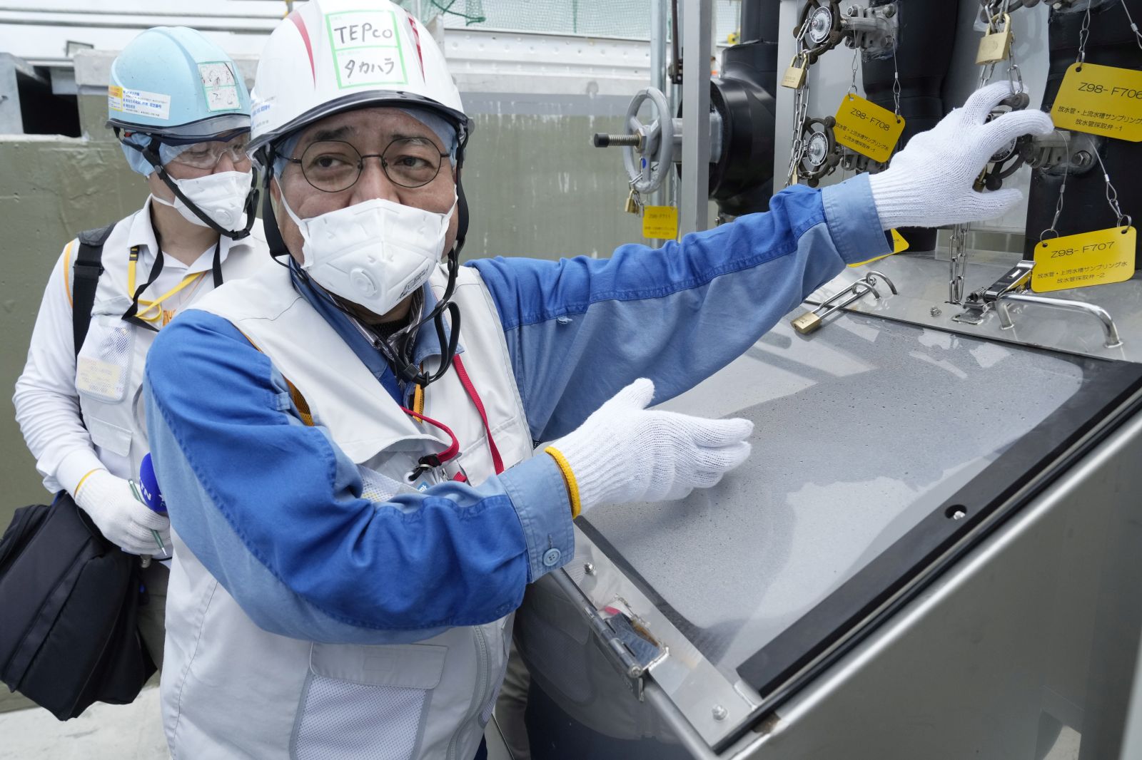 epa10823022 TEPCO official Kenichi Takahara speaks during a tour for foreign media on a facility to take samples of treated radioactive wastewater after dilution for testing before release, part of the facility for the releasing treated radioactive water to sea from the Fukushima Daiichi nuclear power plant, operated by Tokyo Electric Power Company Holdings, also known as TEPCO, in Futaba town, northeastern Japan, 27 August 2023. On 24 August in the early afternoon, plant operator Tokyo Electric Power Company Holdings Inc. (TEPCO) started the discharge of treated radioactive water from the Fukushima nuclear power plant into the Pacific Ocean despite opposition of local fishermen and some neighboring countries. It shall take as long as 30 years to complete the release of the treated radioactive water from more than 1,000 tanks.  EPA/EUGENE HOSHIKO / POOL