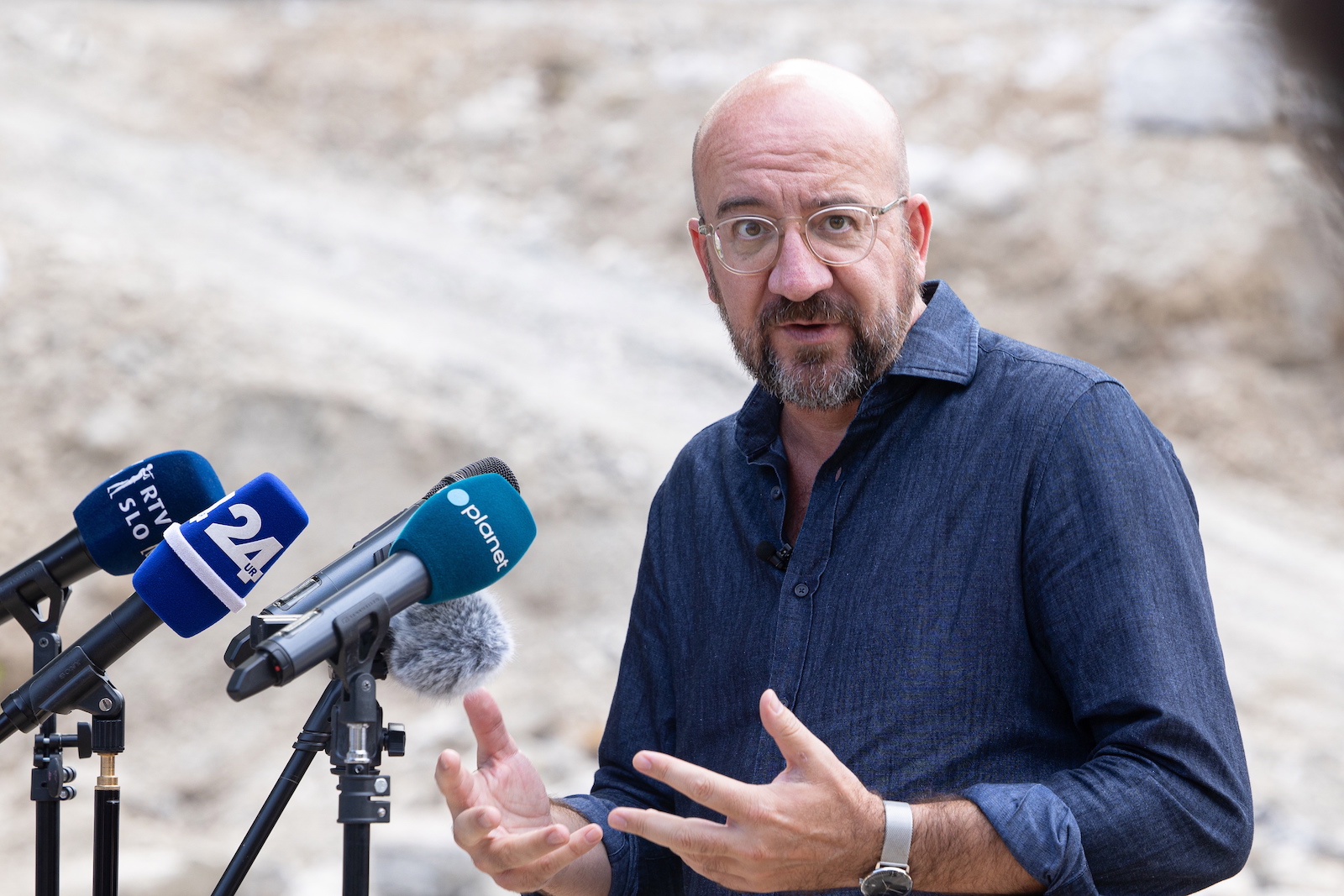 epa10824009 A handout photo made available by the Office of Prime Minister of Slovenia shows EU Council President Charles Michel speaks to the media during the visit to the flood affected areas at Stahovica pri Kamniku, near Kamnik, Slovenia, 27 August 2023. Slovenia has faced the biggest natural disaster in its history' said Slovenian Prime Minister Robert Golob on 05 August. Slovenian Government estimated the damage of roads, energy infrastructure, as well as hundreds of homes is likely to exceed 500 million euros.  EPA/Katja Kodba / OFFICE OF SLOVENIA PM / HANDOUT  HANDOUT EDITORIAL USE ONLY/NO SALES