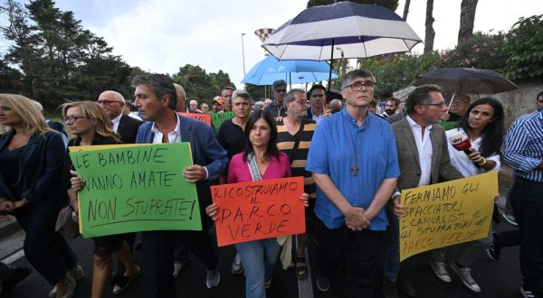 epa10827217 The parish priest Maurizio Patriciello (5-R) attends the procession, against the degradation of the neighborhood, in front of the church of San Paolo Apostolo, in Caivano, near Naples, Italy, 29 August 2023. The Italian Prime Minister Meloni told cabinet 29 August that the crime and drug ridden town of Caivano near Naples would be 'cleaned up' by Italian authorities, after two 13-year-old cosuins were allegedly gang raped last month.  EPA/CIRO FUSCO