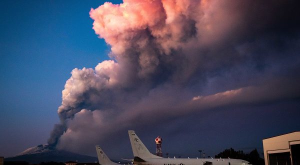 SIGONELLA, Italy (Feb. 16, 2021) Mt. Etna lets off some steam in the background of P-8A Poseidon maritime patrol aircraft assigned to the "Grey Knights" of Patrol Squadron (VP) 46, Feb. 16, 2021. VP-46 is currently forward-deployed to the U.S. 6th Fleet area of operations and is assigned to Commander, Task Force 67, responsible for tactical control of deployed maritime patrol and reconnaissance squadrons throughout Europe and Africa. U.S. 6th Fleet, headquartered in Naples, Italy, conducts a full spectrum of joint and naval operations, often in concert with allied and interagency partners, in order to advance U.S. national security interests and stability in Europe and Africa. (U.S. Navy photo by Mass Communication Specialist 2nd Class Austin Ingram) 210216-N-VH871-1048