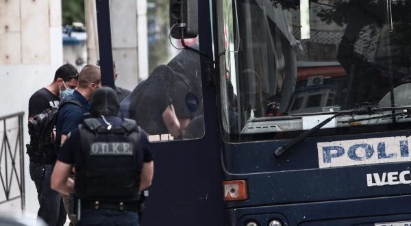 13.08.2023., Atena, Grcka - Poslejdnja skupina privedenih navijaca izlazi pred skudskog istrazitelja izjasniti se o optzbama koje im se stavljau na teret. Inace, svi do sada navijacima koji su izvedeni pred istrazitelja produzen je pritvor. Photo: KOSTAS TZOUMAS/EUROKINISSI/PIXSELL