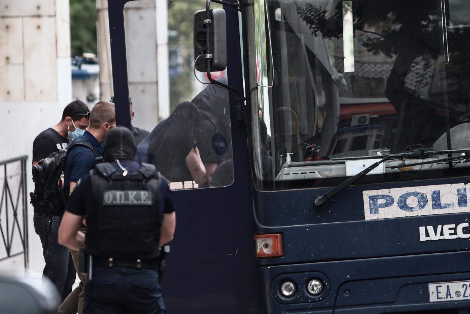 13.08.2023., Atena, Grcka - Poslejdnja skupina privedenih navijaca izlazi pred skudskog istrazitelja izjasniti se o optzbama koje im se stavljau na teret. Inace, svi do sada navijacima koji su izvedeni pred istrazitelja produzen je pritvor. Photo: KOSTAS TZOUMAS/EUROKINISSI/PIXSELL