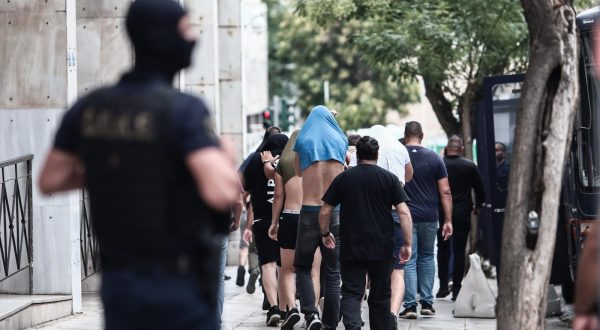 13.08.2023., Atena, Grcka - Poslejdnja skupina privedenih navijaca izlazi pred skudskog istrazitelja izjasniti se o optzbama koje im se stavljau na teret. Inace, svi do sada navijacima koji su izvedeni pred istrazitelja produzen je pritvor. Photo: KOSTAS TZOUMAS/EUROKINISSI/PIXSELL