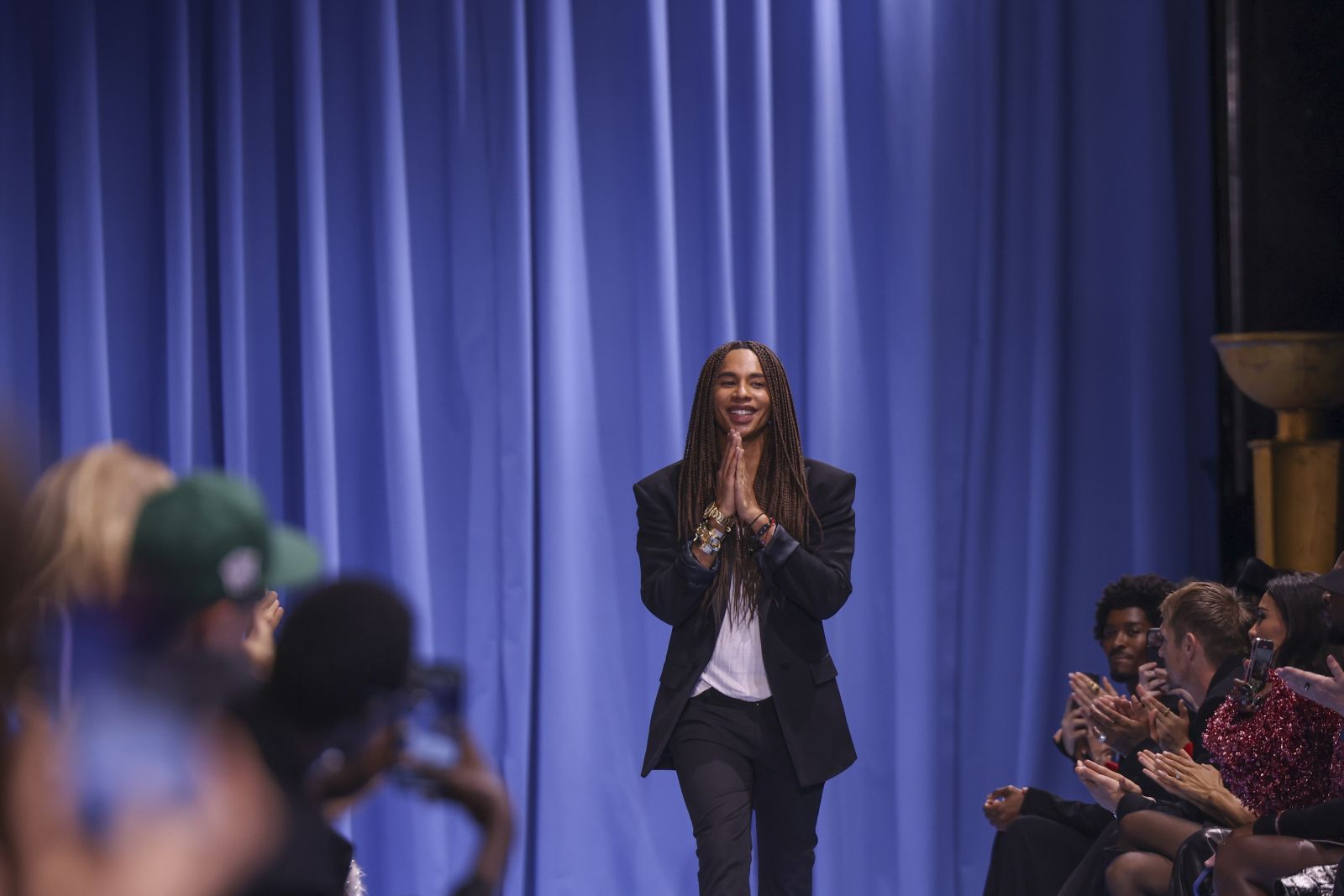 Designer Olivier Rousteing accepts applause after the Balmain Spring/Summer 2024 womenswear fashion collection presented Wednesday, Sept. 27, 2023 in Paris. (AP Photo/Vianney Le Caer)