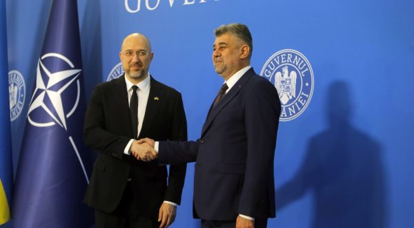 epa10805284 Romania's Prime Minister Marcel Ciolacu (R) shakes hands with Ukraine's Prime Minister Denys Shmyhal (L) in Bucharest, Romania, 18 August 2023. Prime Minister Shmyhal is on an official visit to Romania.  EPA/Bogdan Cristel