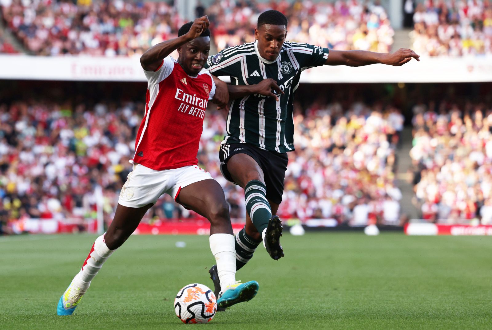 epa10838191 Arsenal’s Eddie Nketiah (L) and Manchester United's Anthony Martial (R) in action during the English Premier League soccer match between Arsenal FC and Manchester United, in London, Britain, 03 September 2023.  EPA/NEIL HALL   EDITORIAL USE ONLY. No use with unauthorized audio, video, data, fixture lists, club/league logos or 'live' services. Online in-match use limited to 120 images, no video emulation. No use in betting, games or single club/league/player publications.